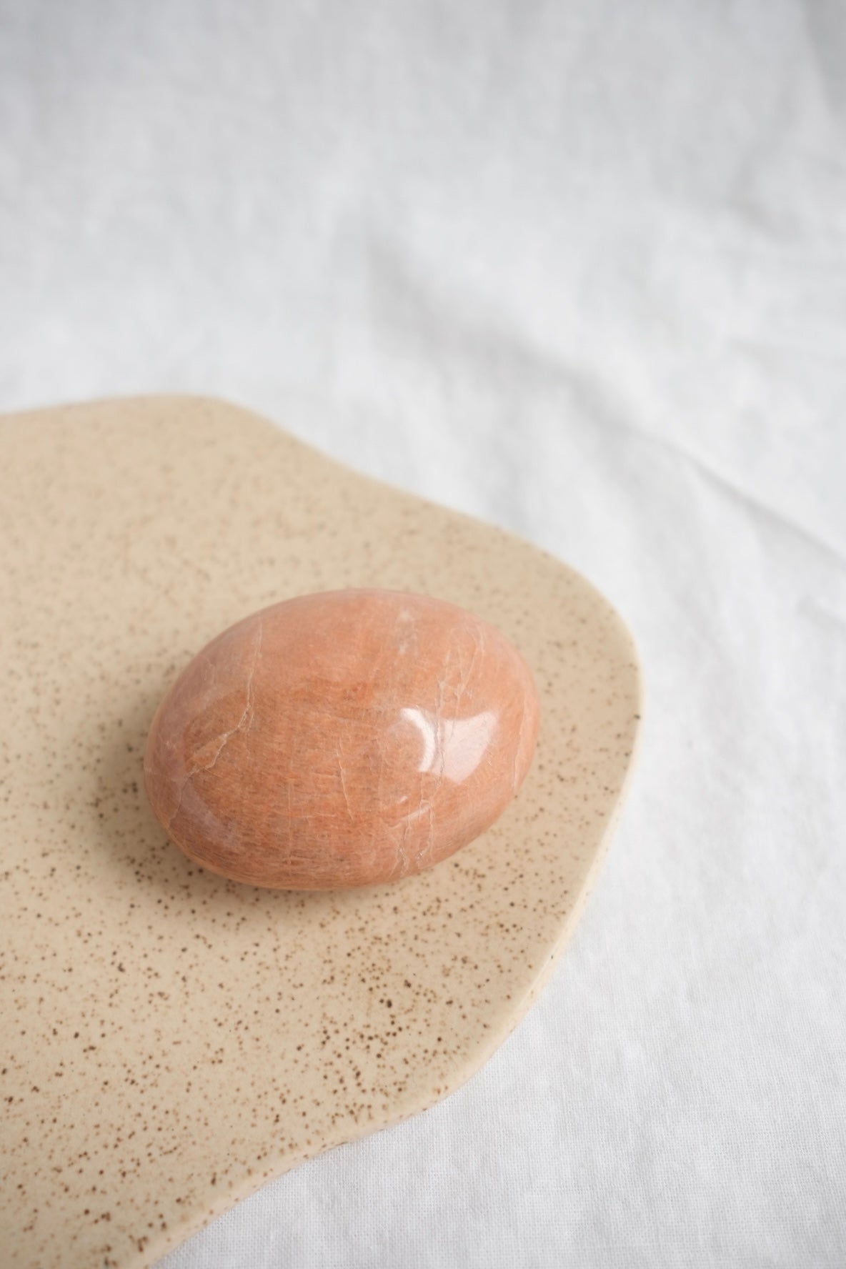 peach moonstone palm stone