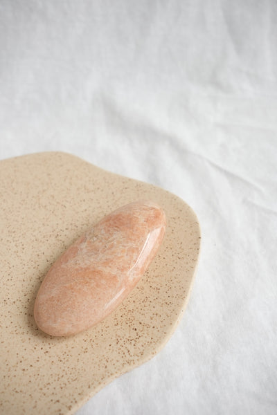 peach moonstone palm stone